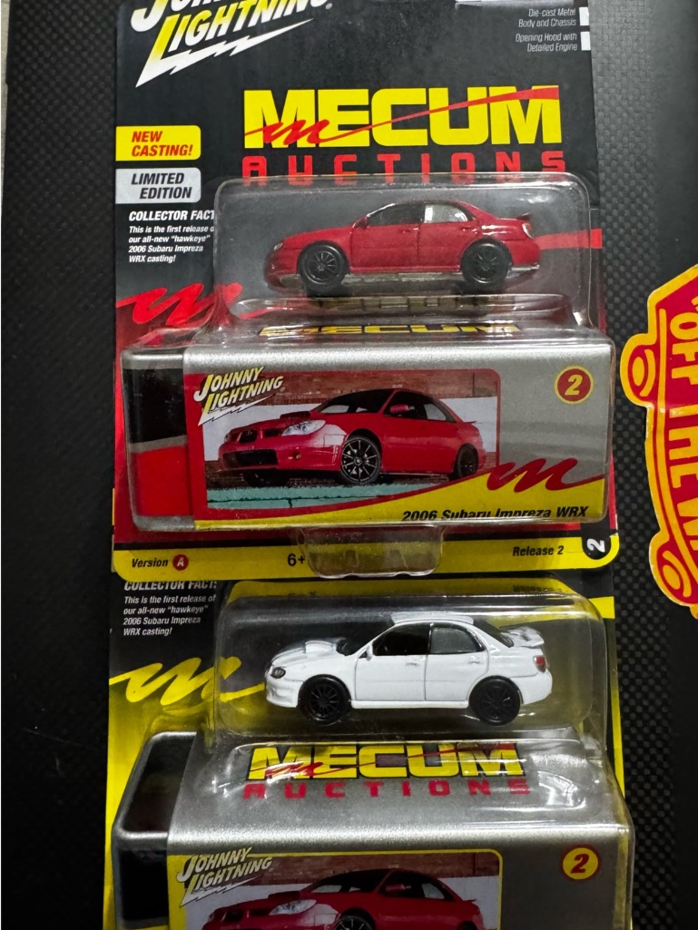 Johnny Lightning Mecum Auctions 2006 Subaru Impreza WRX Diecast - Red & White